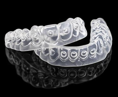 Upper and lower clear bleaching trays with gel placement dots
